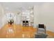 Open living space with hardwood floors connects to the dining area, featuring a ceiling fan at 548 S Hyer Ave # 1, Orlando, FL 32801
