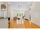 Open-concept floor plan with hardwood floors, connecting the living room, dining area, and kitchen at 548 S Hyer Ave # 1, Orlando, FL 32801