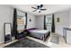 Bright bedroom with a ceiling fan, tile floors, and ample natural light at 558 Tyler Ave, Deltona, FL 32725