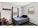 Simple bedroom featuring a zebra patterned bedspread, and neutral walls at 558 Tyler Ave, Deltona, FL 32725