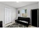 Cozy bedroom featuring a futon, a closet, and a window for natural light at 558 Tyler Ave, Deltona, FL 32725