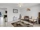 Inviting living room with a decorative rug, comfortable seating, and natural light at 558 Tyler Ave, Deltona, FL 32725