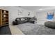 Open-concept living room featuring a sectional sofa and entertainment area with games at 558 Tyler Ave, Deltona, FL 32725