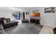 Spacious living room with a large window, tile flooring, and comfortable seating at 558 Tyler Ave, Deltona, FL 32725