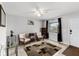 Bright living room with neutral tones, comfortable seating, and a decorative rug at 558 Tyler Ave, Deltona, FL 32725