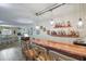 Entertaining area with wood bar, and access to dining area, perfect for hosting at 704 Tangerine Ct, Winter Garden, FL 34787