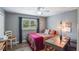 Cozy bedroom with natural light, modern desk, and stylish decor accents at 704 Tangerine Ct, Winter Garden, FL 34787