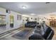 Large living room with wood floors and a bar area, offering space and style at 704 Tangerine Ct, Winter Garden, FL 34787