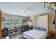 Comfortable office area featuring a murphy bed, wood-look floors, neutral paint, and natural light at 704 Tangerine Ct, Winter Garden, FL 34787