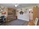 This room features a wooden murphy bed, neutral paint, wood look floors and neutral color tones at 704 Tangerine Ct, Winter Garden, FL 34787