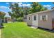 A storage shed in the backyard offers extra space for tools, equipment, and other belongings at 704 Tangerine Ct, Winter Garden, FL 34787