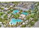Aerial view showcasing resort-style pool, volleyball court, and neighborhood amenities at 8518 Nemours Pkwy, Orlando, FL 32827