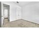 Cozy bedroom featuring neutral carpet, white walls, and closet for ample storage at 8518 Nemours Pkwy, Orlando, FL 32827