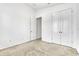 Bright bedroom featuring neutral carpet, white walls, and closet for ample storage at 8518 Nemours Pkwy, Orlando, FL 32827