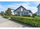 Charming single-story home with covered porch and meticulously maintained front yard at 8518 Nemours Pkwy, Orlando, FL 32827