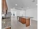 Modern kitchen features granite countertops, island, and stainless steel appliances at 8518 Nemours Pkwy, Orlando, FL 32827