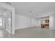 Open-concept room featuring tile floors and leads to a kitchen area; great flow for entertaining at 8518 Nemours Pkwy, Orlando, FL 32827