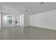 Bright living area with tile floors, neutral walls, and a glass door leading to the outside at 8518 Nemours Pkwy, Orlando, FL 32827