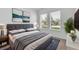 Modern bedroom features gray decor, plush carpet, bright windows, and stylish furniture at 8518 Nemours Pkwy, Orlando, FL 32827