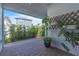 Covered patio featuring pavers, landscaping, and privacy creating a relaxing outdoor space at 8518 Nemours Pkwy, Orlando, FL 32827