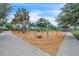 Well-equipped playground features swings and overhead bars for recreation and fun at 8518 Nemours Pkwy, Orlando, FL 32827