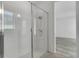 A pristine, modern bathroom with a glass-enclosed shower and contemporary fixtures at 8518 Nemours Pkwy, Orlando, FL 32827