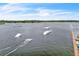 Aerial view of the wakeboarding park, with jumps, rails, and a rider being pulled across the water at 8518 Nemours Pkwy, Orlando, FL 32827