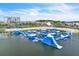 Aerial view of the amazing floating water park, sandy beach, and community amenities on a sunny day at 8518 Nemours Pkwy, Orlando, FL 32827