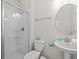 Bright bathroom features a glass-enclosed shower and modern vanity at 8822 Interlocking Ct, Davenport, FL 33896