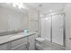 Bathroom showcasing a shower, modern vanity with a sink, and a neutral color scheme at 8822 Interlocking Ct, Davenport, FL 33896
