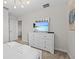 Well-lit bedroom boasts soft carpet, a TV, and a dresser with ample storage at 8822 Interlocking Ct, Davenport, FL 33896