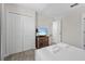 Cozy bedroom with soft carpet, closet, and a TV for relaxing evenings at 8822 Interlocking Ct, Davenport, FL 33896