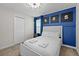 This bedroom features a double bed and Star Wars themed artwork at 8822 Interlocking Ct, Davenport, FL 33896