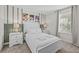Inviting bedroom with decorative wall trim, plush bedding, and bedside tables at 8822 Interlocking Ct, Davenport, FL 33896