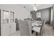 Elegant dining room featuring stylish furnishings, a modern chandelier, and ample seating for guests at 8822 Interlocking Ct, Davenport, FL 33896