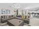 Comfortable living room offering a large sectional sofa, contemporary decor, and an open floor plan at 8822 Interlocking Ct, Davenport, FL 33896