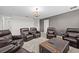 Living room features reclining chairs and a decorative chandelier at 8822 Interlocking Ct, Davenport, FL 33896