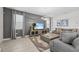 Comfortable living room featuring sleek gray walls, plush seating, and stylish decor at 8822 Interlocking Ct, Davenport, FL 33896