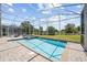 Sparkling pool surrounded by a screened enclosure at 8822 Interlocking Ct, Davenport, FL 33896