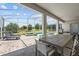 Screened-in pool area featuring a hot tub and outdoor dining area at 8822 Interlocking Ct, Davenport, FL 33896
