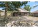 View of the screened in patio and backyard at 9145 Fort Jefferson Blvd, Orlando, FL 32822
