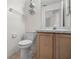 Bathroom featuring tile floors, white toilet, wood cabinets, and a marble countertop sink at 9145 Fort Jefferson Blvd, Orlando, FL 32822