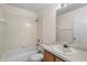 Bright bathroom featuring a shower-tub combo, a vanity, and a large mirror at 9145 Fort Jefferson Blvd, Orlando, FL 32822