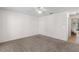 This bedroom features neutral carpet and a ceiling fan at 9145 Fort Jefferson Blvd, Orlando, FL 32822