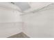 Walk-in closet featuring carpet floors, wire shelving, and a white interior at 9145 Fort Jefferson Blvd, Orlando, FL 32822