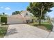 Well maintained two-story home featuring an attached two car garage and mature landscaping at 9145 Fort Jefferson Blvd, Orlando, FL 32822