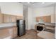 Bright kitchen featuring stainless steel refrigerator and neutral countertops at 9145 Fort Jefferson Blvd, Orlando, FL 32822