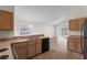 Open kitchen showcasing stainless steel appliances and access to the living area at 9145 Fort Jefferson Blvd, Orlando, FL 32822