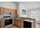 Well-lit kitchen featuring neutral countertops, a black dishwasher, and a sink at 9145 Fort Jefferson Blvd, Orlando, FL 32822