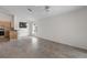 Open living space with tiled floors, ceiling fan and a view to kitchen area at 9145 Fort Jefferson Blvd, Orlando, FL 32822